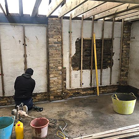 Damp proofing and plastering an old garage