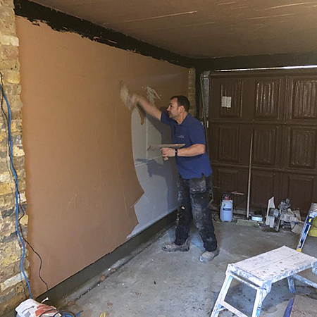 Damp proofing and plastering an old garage